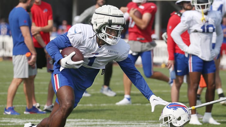 Bills wide receiver Curtis Samuel puts out the stiff arm.