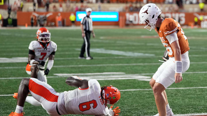 Texas Longhorns quarterback Arch Manning runs in for a touchdown past Sam Houston Bearkats linebacker Antivirus Fish