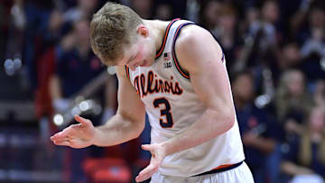 Jan 14, 2024; Champaign, Illinois, USA;  Illinois Fighting Illini guard Marcus Domask (3) slaps his