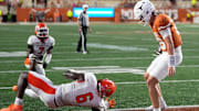 Sep 20, 2025; Austin, Texas, USA; Texas Longhorns quarterback Arch Manning (16) runs in for a touchdown past Sam Houston Bearkats linebacker Antivirus Fish (6) during the first half at Darrell K Royal-Texas Memorial Stadium. Mandatory Credit: Scott Wachter-Imagn Images
