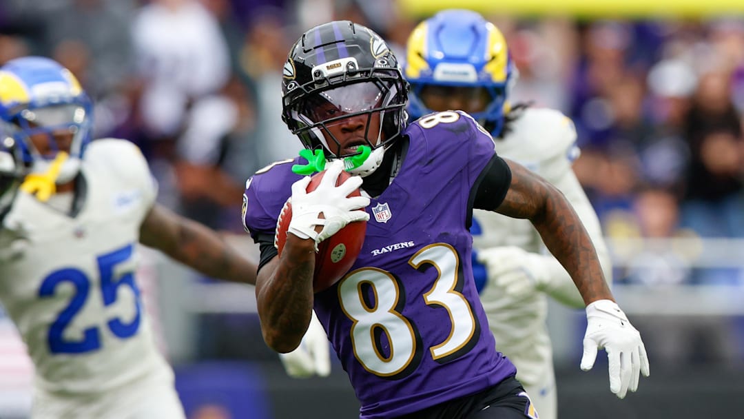 Oct 12, 2025; Baltimore, Maryland, USA; Baltimore Ravens wide receiver Lajohntay Wester (83) carries the ball against the Los Angeles Rams during the second quarter of the game at M&T Bank Stadium. Mandatory Credit: Peter Casey-Imagn Images