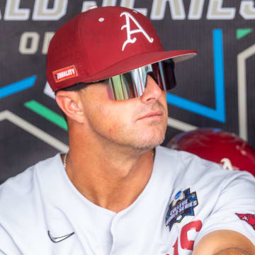  Arkansas Razorbacks assistant coach Nate Thompson sits in the dugout before a game against the Ole Miss Rebels at Charles Schwab Field. 