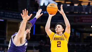 Mar 12, 2025; Indianapolis, IN, USA;  Minnesota Golden Gophers guard Mike Mitchell Jr. (2) shoots the ball while  Northwestern Wildcats center Matthew Nicholson (34) defends in the second half at Gainbridge Fieldhouse. Mandatory Credit: Trevor Ruszkowski-Imagn Images