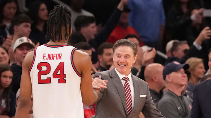 Mar 15, 2025; New York, NY, USA;  St. John's basketball forward Zuby Ejiofor (24) is greeted by St. John's Red Storm head coach Rick Pitino as the game ends against the Creighton Bluejays at Madison Square Garden.
