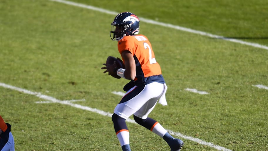 Kendall Hinton drops back to pass against the Saints.