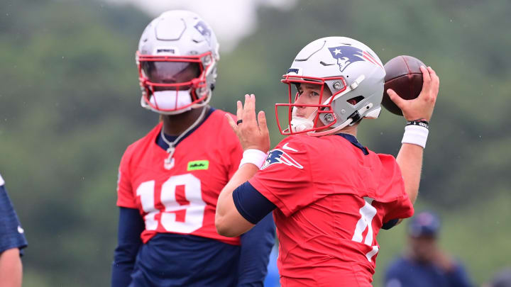 Jul 24, 2024; Foxborough, MA, USA;  New England Patriots quarterback Bailey Zappe (4) throws a pass during training camp at Gillette Stadium. Mandatory Credit: Eric Canha-USA TODAY Sports