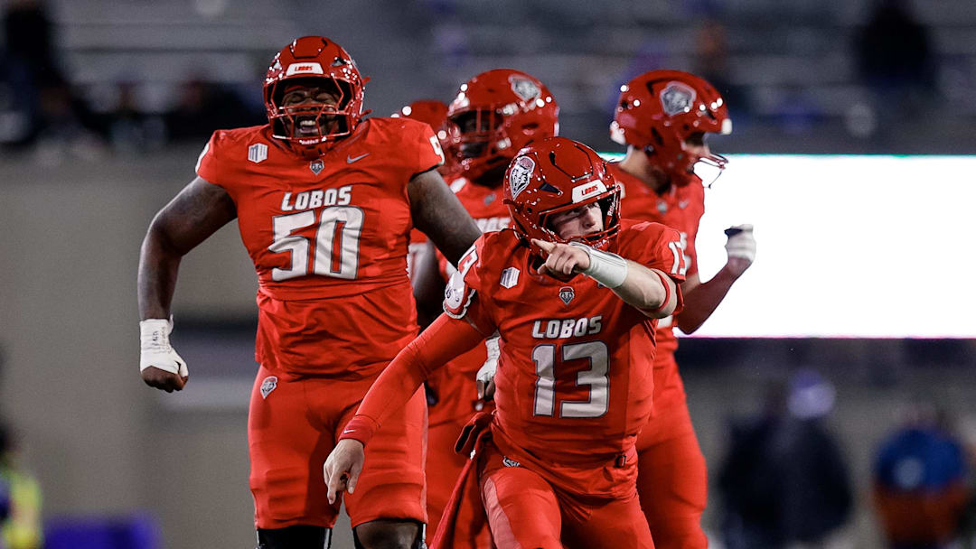 Nov 22, 2025; Colorado Springs, Colorado, USA; New Mexico Lobos quarterback James Laubstein (13) and offensive lineman Isaiah Sillemon (50).