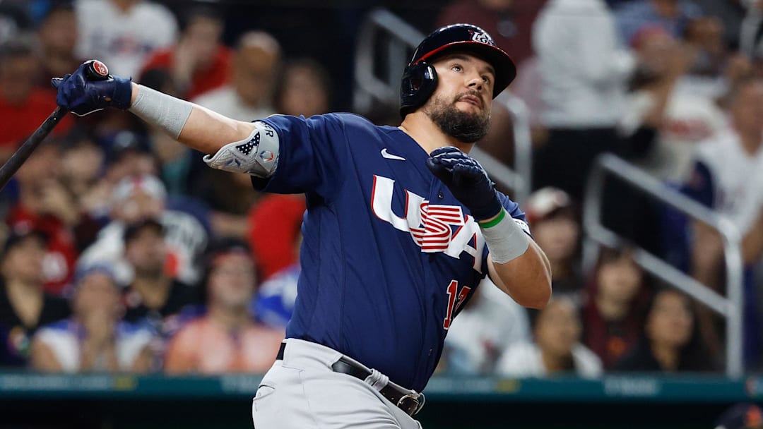 Mar 21, 2023; Miami, Florida, USA; USA designated hitter Kyle Schwarber (12) hits a home run against Japan in the eighth inning at LoanDepot Park. Mandatory Credit: Rhona Wise-Imagn Images