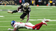 Oct 5, 2025; New Orleans, Louisiana, USA; New Orleans Saints running back Alvin Kamara (41) runs the ball against the New York Giants during the second quarter at Caesars Superdome. Mandatory Credit: Matthew Hinton-Imagn Images