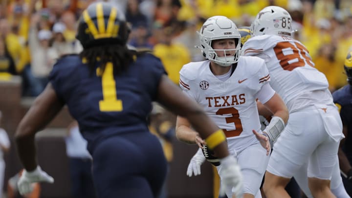 Sep 7, 2024; Ann Arbor, Michigan, USA; Texas Longhorns quarterback Quinn Ewers (3) scrambles in the first half against the Michigan Wolverines at Michigan Stadium. Mandatory Credit: Rick Osentoski-Imagn Images