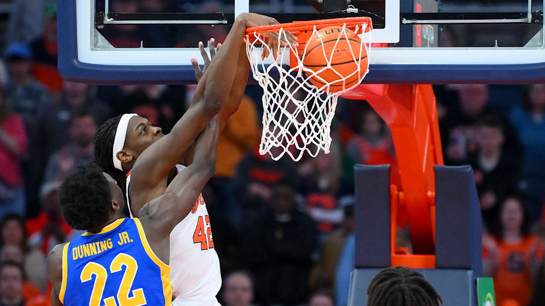 Mar 7, 2026; Syracuse, New York, USA; Syracuse Orange forward William Kyle III (42) dunks against Pittsburgh Panthers guard Barry Dunning Jr. (22) during the first half at the JMA Wireless Dome. Mandatory Credit: Rich Barnes-Imagn Images