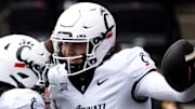 Cincinnati Bearcats quarterback Brendan Sorsby (2) reacts with Cincinnati Bearcats wide receiver Tyrin Smith (4) after scoring a touchdown in the first quarter of the College Football game between the Cincinnati Bearcats and the Towson Tigers at Nippert Stadium in Cincinnati on Saturday, Aug. 31, 2024.