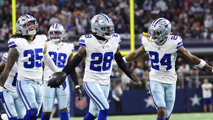 Dallas Cowboys safety Malik Hooker celebrates with teammates after making an interception against the Houston Texans Dallas Cowboys safety Malik Hooker celebrates with teammates after making an interception against the Houston Texans