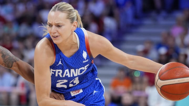 Jul 29, 2024; Villeneuve-d'Ascq, France; France guard Marine Johannes (23) dribbles the ball while defended by Canada guard Shay Colley (2) during the first quarter during the Paris 2024 Olympic Summer Games at Stade Pierre-Mauroy. Mandatory Credit: John David Mercer-USA TODAY Sports