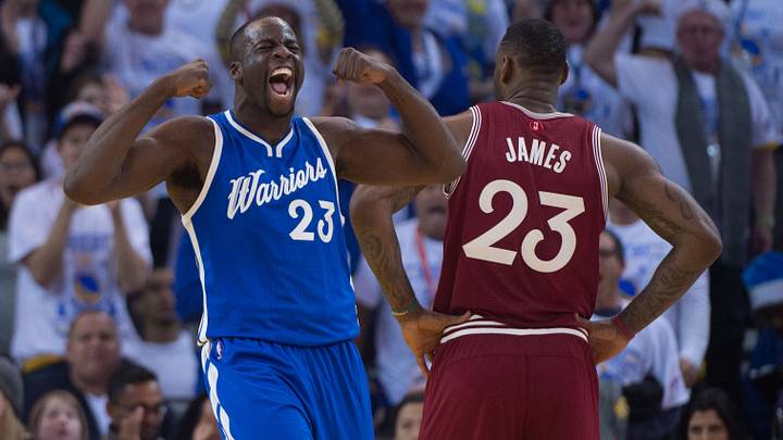 December 25, 2015; Oakland, CA, USA; Golden State Warriors forward Draymond Green (23, left) celebrates against Cleveland Cavaliers forward LeBron James (23, right) during the first quarter in a NBA basketball game on Christmas at Oracle Arena. The Warriors defeated the Cavaliers 89-83.  Mandatory Credit: Kyle Terada-USA TODAY Sports