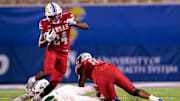 Aug 29, 2025; Lawrence, Kansas, USA; Kansas Jayhawks running back John Kelly (24) runs the ball during the second half against the Wagner Seahawks at David Booth Kansas Memorial Stadium. Mandatory Credit: William Purnell-Imagn Images