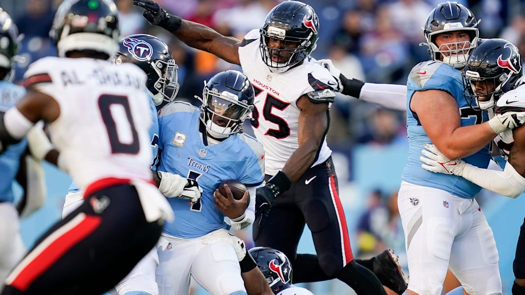 Tennessee Titans quarterback Cam Ward (1) is sacked by Houston Texans defensive tackle Tommy Togiai (72) during the fourth quarter at Nissan Stadium in Nashville, Tenn., Sunday, Nov. 16, 2025.