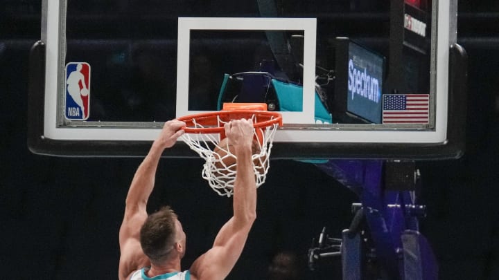 Oct 30, 2023; Charlotte, North Carolina, USA; Charlotte Hornets forward Gordon Hayward (20) dunks against the Brooklyn Nets during the second half at Spectrum Center. Mandatory Credit: Jim Dedmon-USA TODAY Sports