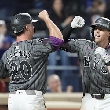 May 10, 2025; New York City, New York, USA; New York Mets first baseman Pete Alonso (20) congratulates New York Mets third baseman Brett Baty (7) for hitting a three run home run against the Chicago Cubs during the fourth inning at Citi Field. Mandatory Credit: Gregory Fisher-Imagn Images