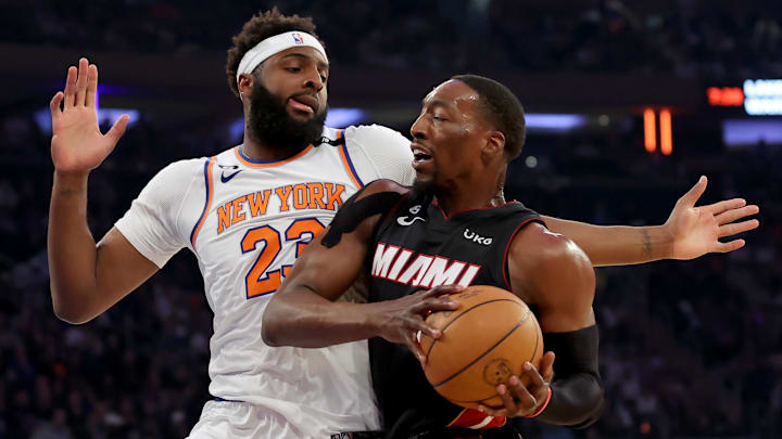 May 2, 2023; New York, New York, USA; Miami Heat center Bam Adebayo (13) drives to the basket against New York Knicks center Mitchell Robinson (23) during the first quarter of game two of the 2023 NBA Eastern Conference semifinal playoffs at Madison Square Garden. Mandatory Credit: Brad Penner-Imagn Images