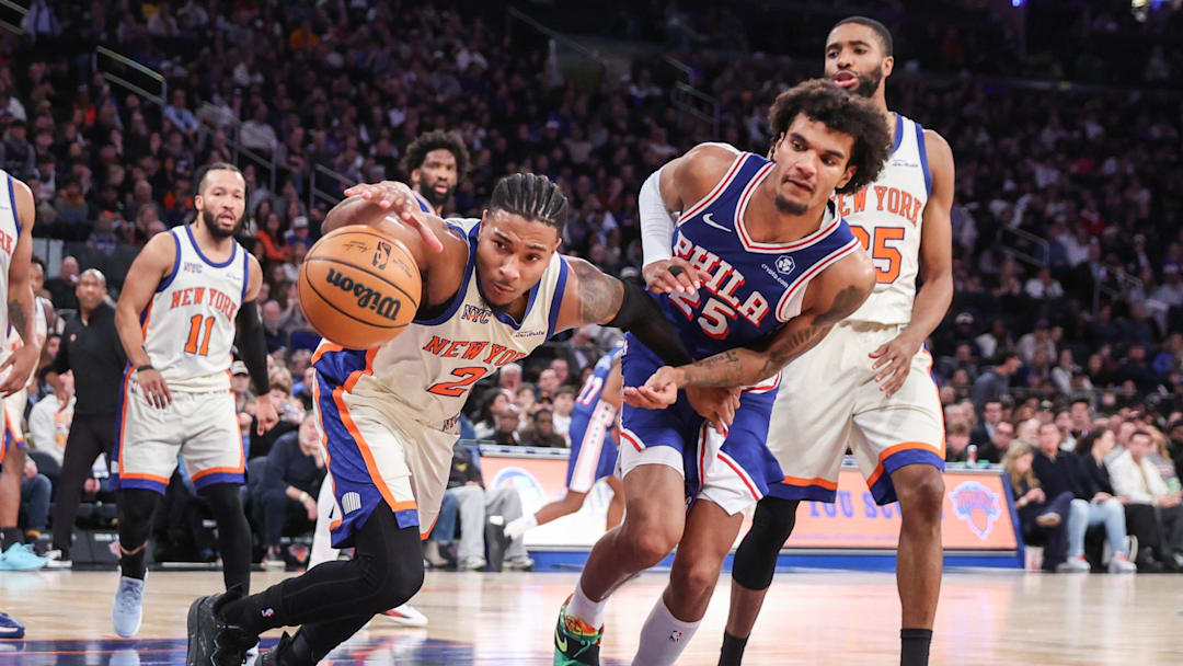 Jan 3, 2026; New York, New York, USA; New York Knicks guard Miles McBride (2) and Philadelphia 76ers forward Dominick Barlow (25) chase after a loose ball in the third quarter at Madison Square Garden. Mandatory Credit: Wendell Cruz-Imagn Images