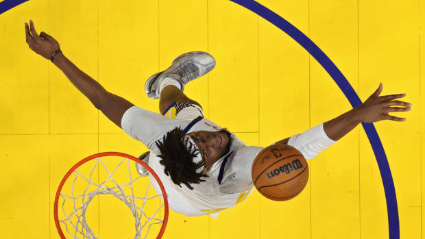Jun 13, 2022; San Francisco, California, USA; Golden State Warriors center Kevon Looney (5) jumps for a rebound in game five of the 2022 NBA Finals against the Boston Celtics at Chase Center. Mandatory Credit: Ezra Shaw/Pool Photo-USA TODAY Sports