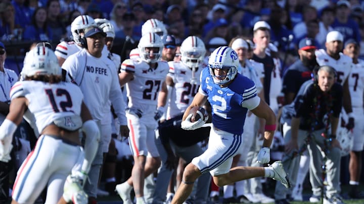 Oct 12, 2024; Provo, Utah, USA; Brigham Young Cougars wide receiver Chase Roberts (2) runs with the ball after a catch against the Arizona Wildcats during the third quarter at LaVell Edwards Stadium. Mandatory Credit: Rob Gray-Imagn Images