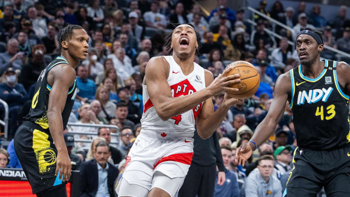 Feb 26, 2024; Indianapolis, Indiana, USA; Toronto Raptors forward Scottie Barnes (4) shoots the ball while Indiana Pacers guard Bennedict Mathurin (00) defends in the first half at Gainbridge Fieldhouse. Mandatory Credit: Trevor Ruszkowski-USA TODAY Sports