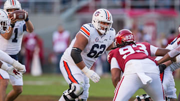 Nov 11, 2023; Fayetteville, Arkansas, USA;  Auburn Tigers offensive lineman Kam Stutts (62) blocks during the second quarter against the Arkansas Razorbacks at Donald W. Reynolds Razorback Stadium. Auburn won 48-10. Mandatory Credit: Brett Rojo-Imagn Images