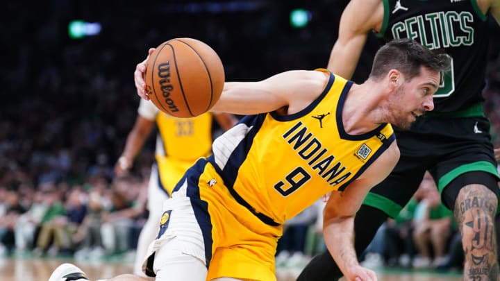 May 23, 2024; Boston, Massachusetts, USA; Indiana Pacers guard T.J. McConnell (9) dribbles the ball against Boston Celtics forward Jayson Tatum (0) in the second half during game two of the eastern conference finals for the 2024 NBA playoffs at TD Garden. Mandatory Credit: David Butler II-USA TODAY Sports
