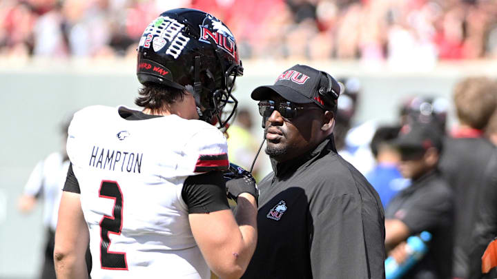 Sep 28, 2024; Raleigh, North Carolina, USA; Nothern Illinois Huskies head coach Thomas Hammock talks with quarterback Ethan Hampton (2) during the second quarter against the North Carolina State Wolfpack at Carter-Finley Stadium. Mandatory Credit: Zachary Taft-Imagn Images Sep 28, 2024; Raleigh, North Carolina, USA; Nothern Illinois Huskies head coach Thomas Hammock talks with quarterback Ethan Hampton (2) during the second quarter against the North Carolina State Wolfpack at Carter-Finley Stadium. Mandatory Credit: Zachary Taft-Imagn Images