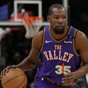 Mar 30, 2025; Phoenix, Arizona, USA; Phoenix Suns forward Kevin Durant (35) drives against the Houston Rockets in the first half at Footprint Center. Mandatory Credit: Rick Scuteri-Imagn Images