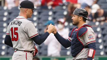 Former Atlanta Braves relief pitcher Sean Newcomb (15) celebrates with Braves catcher Alex Jackson (12) after their game against the Washington Nationals at Nationals Park.