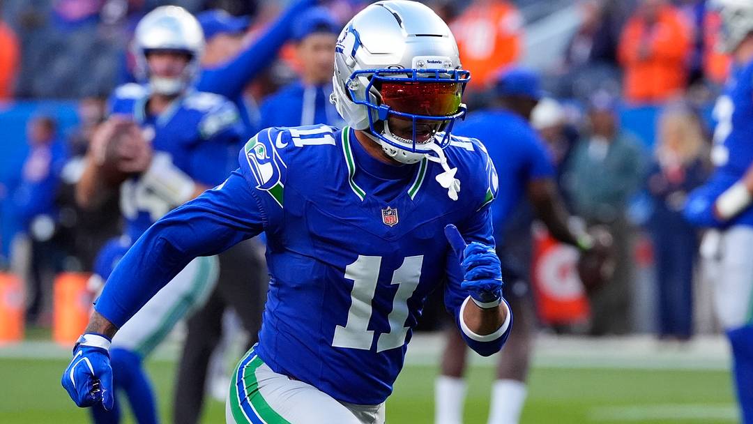 Seattle Seahawks wide receiver Jaxon Smith-Njigba warms up before the game against the Denver Broncos. Seattle Seahawks wide receiver Jaxon Smith-Njigba warms up before the game against the Denver Broncos.