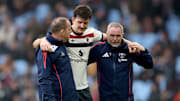 Maguire had to be helped off against Villa