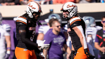 Oklahoma State's Cam Smith (3) and Parker Robertson (8) celebrate in the first half of the college football game between Oklahoma State University and the Kansas State Wildcats at Boone Pickens Stadium in Stillwater, Okla., Saturday Nov. 15, 2025.