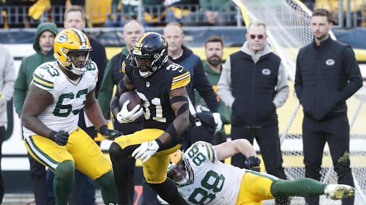 Nov 12, 2023; Pittsburgh, Pennsylvania, USA;  Pittsburgh Steelers safety Keanu Neal (31) returns an interception against the Green Bay Packers during the fourth quarter at Acrisure Stadium. Pittsburgh won 23-19. Mandatory Credit: Charles LeClaire-Imagn Images