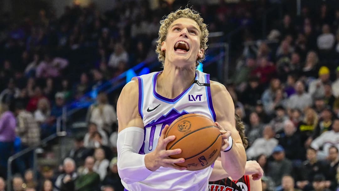 Nov 16, 2025; Salt Lake City, Utah, USA; Utah Jazz forward/center Lauri Markkanen (23) makes a layup against Chicago Bulls guard Josh Giddey (3) during the first half at Delta Center. Mandatory Credit: Peter Creveling-Imagn Images