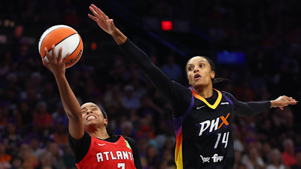 A photo of Jordin Canada attempting a layup