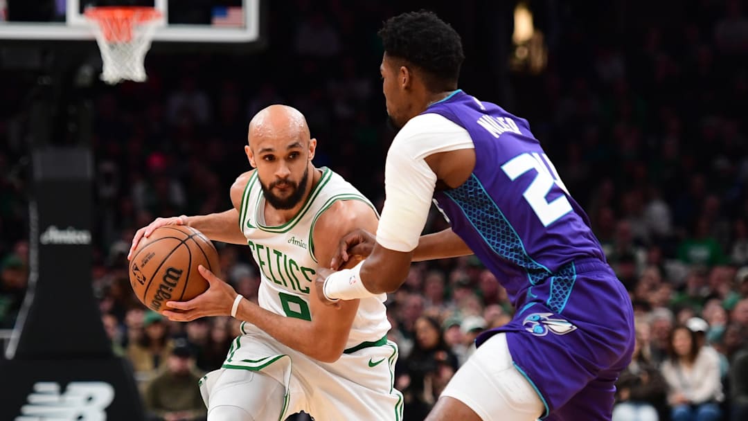 Mar 4, 2026; Boston, Massachusetts, USA; Charlotte Hornets forward Brandon Miller (24) defends Boston Celtics guard Derrick White (9) during the first half at TD Garden. Mandatory Credit: Bob DeChiara-Imagn Images