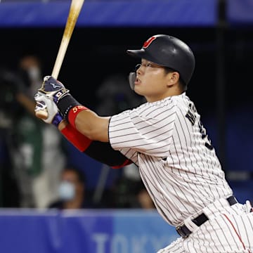 Aug 7, 2021; Yokohama, Japan; Team Japan infielder Munetaka Murakami (55) hits a solo home run against USA during the third inning in the baseball gold medal match during the Tokyo 2020 Olympic Summer Games at Yokohama Baseball Stadium. Mandatory Credit: Yukihito Taguchi-Imagn Images