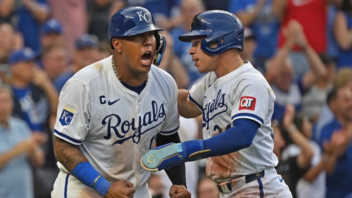 Jul 27, 2024; Kansas City, Missouri, USA;  Kansas City Royals catcher Freddy Fermin (34) and Salvador Perez (13) react after scoring in the sixth inning against the Chicago Cubs at Kauffman Stadium. Mandatory Credit: Peter Aiken-USA TODAY Sports