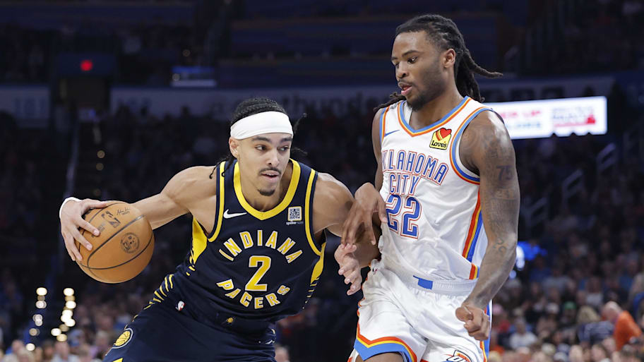 Indiana Pacers guard Nembhard drives down the court beside Oklahoma City Thunder guard Wallace during the second half at Paycom Center.  | Alonzo Adams-Imagn Images