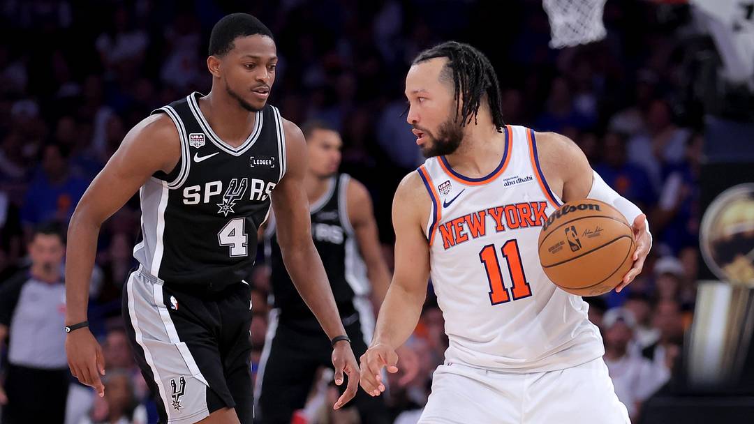 New York Knicks guard Jalen Brunson controls the ball against San Antonio Spurs guard De'aaron Fox during the fourth quarter of Game 4 of the 2026 NBA Finals at Madison Square Garden.
