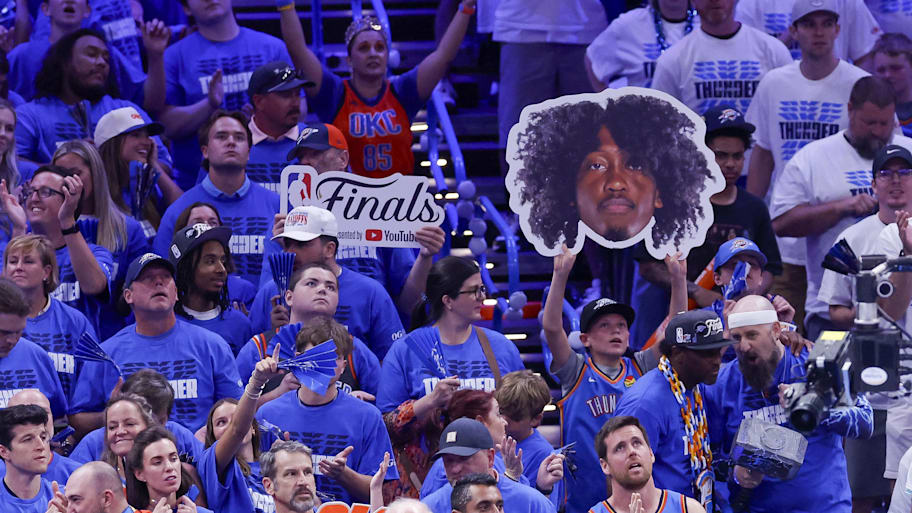 A fan holds up a cutout of Oklahoma City Thunder forward Jalen Williams during the fourth quarter against the Indiana Pacers in Game 5 of the 2025 NBA Finals at Paycom Center. | Alonzo Adams-Imagn Images