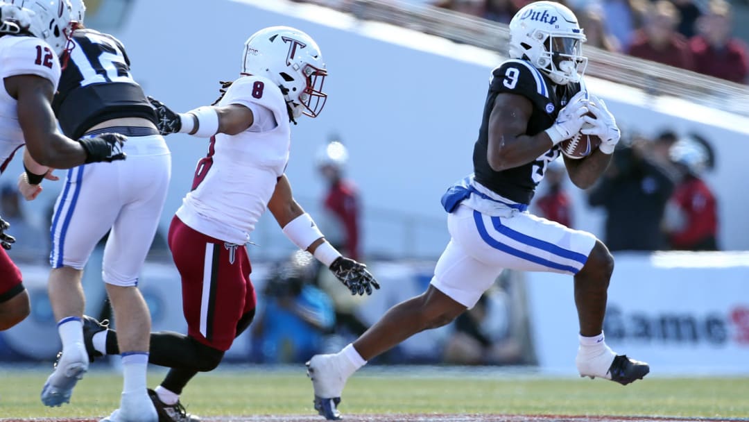 Dec 23, 2023; Birmingham, AL, USA; Duke Blue Devils running back Jaquez Moore (9) runs after a catch during the first half against the Troy Trojans at Protective Stadium. Mandatory Credit: Petre Thomas-USA TODAY Sports