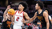 Mar 12, 2025; Indianapolis, IN, USA;  Rutgers Scarlet Knights guard Dylan Harper (2) shoots the ball while USC Trojans guard Desmond Claude (1) defends in the second half at Gainbridge Fieldhouse. Mandatory Credit: Trevor Ruszkowski-Imagn Images