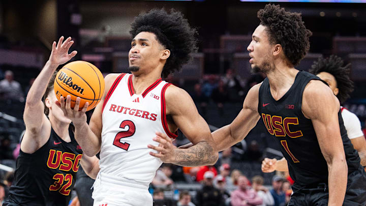 Mar 12, 2025; Indianapolis, IN, USA; Rutgers Scarlet Knights guard Dylan Harper (2) shoots the ball while USC Trojans guard Desmond Claude (1) defends in the second half at Gainbridge Fieldhouse. Mandatory Credit: Trevor Ruszkowski-Imagn Images Mar 12, 2025; Indianapolis, IN, USA; Rutgers Scarlet Knights guard Dylan Harper (2) shoots the ball while USC Trojans guard Desmond Claude (1) defends in the second half at Gainbridge Fieldhouse. Mandatory Credit: Trevor Ruszkowski-Imagn Images