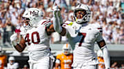 Mississippi State Bulldogs linebacker Nic Mitchell (40) and linebacker Zakari Tillman (7) react after a fumble recovery against the Tennessee Volunteers during the first half at Davis Wade Stadium at Scott Field.