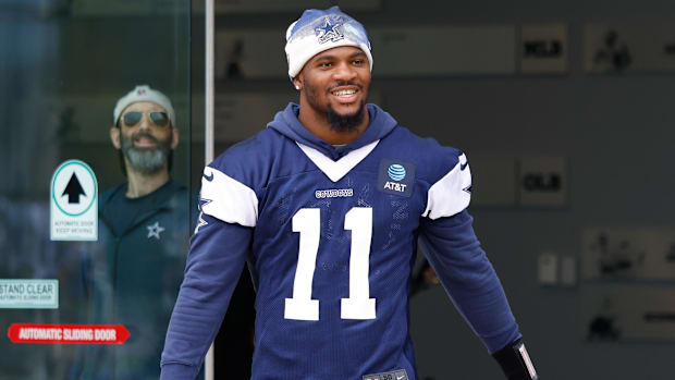 Dallas Cowboys defensive end Micah Parsons (11) walks onto the practice field at the Ford Center.